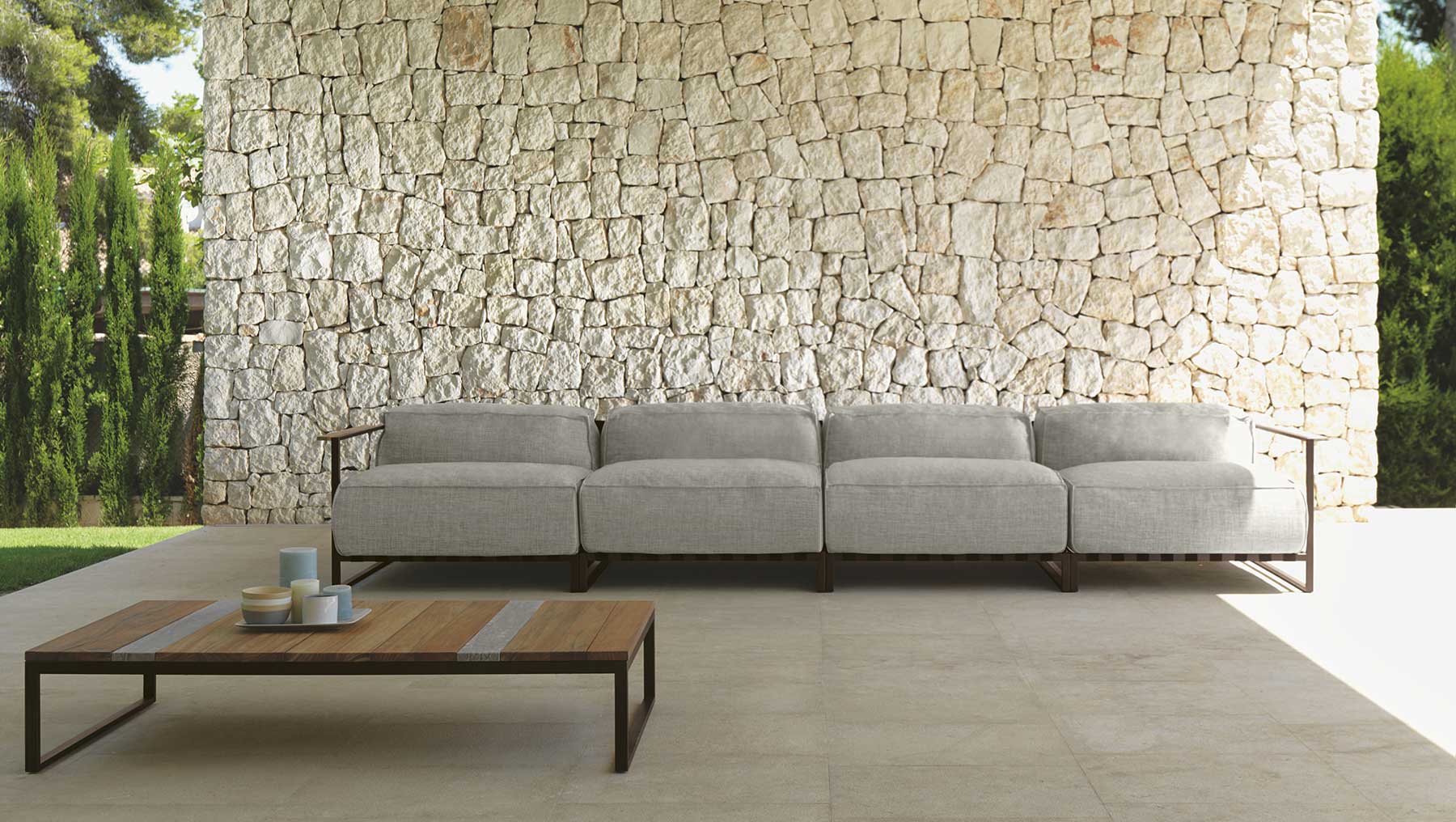 Outdoor sofa set. Grey luxury garden furniture. Modern and contemporary patio lounge sofa. Design by Ramon Esteve. Weatherproof fabric covering.