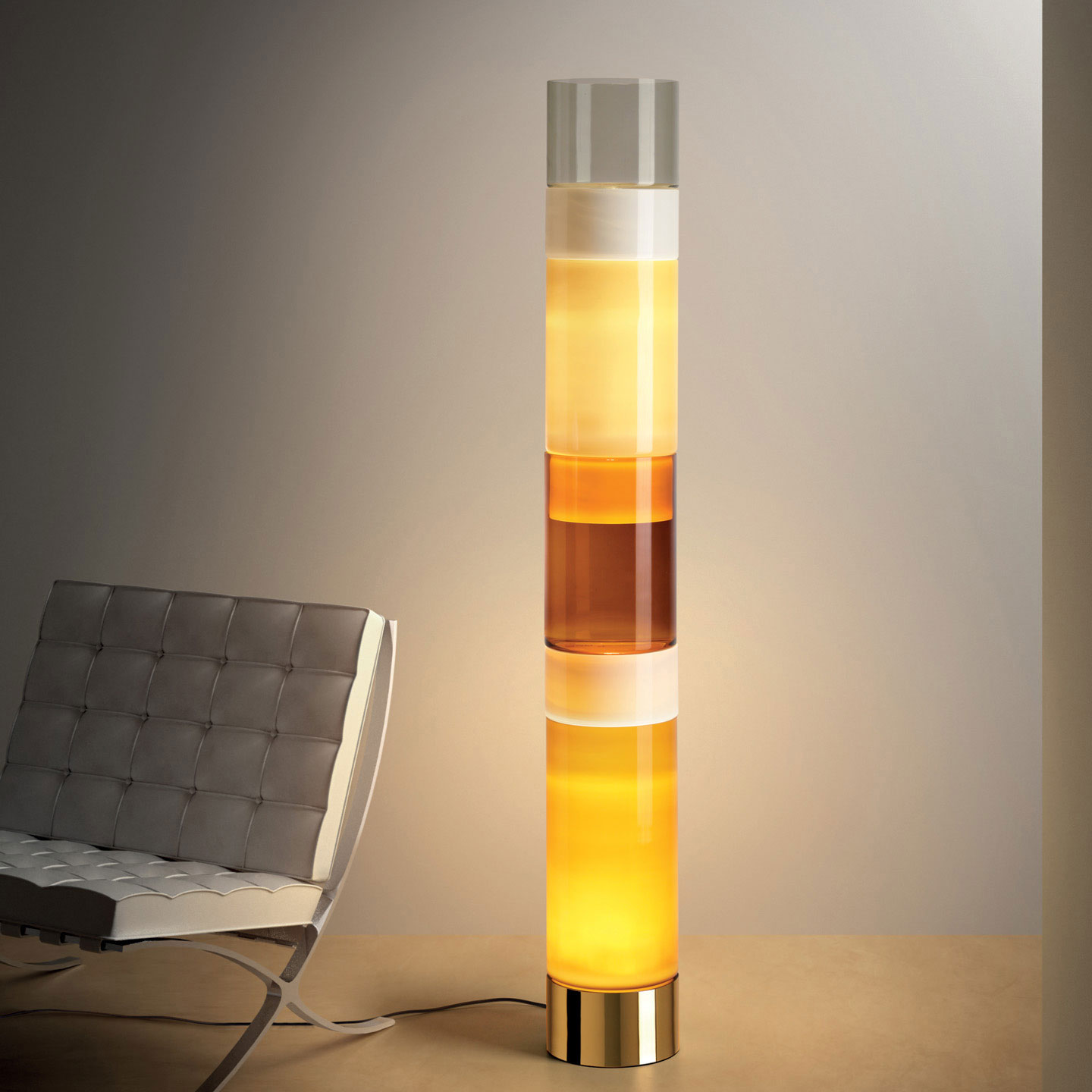 Stacking is a chic Murano glass floor lamp and the epitome of contemporary cool. This Italian design floor lamp showcases blown glass cylinders in distinct colors and sizes.