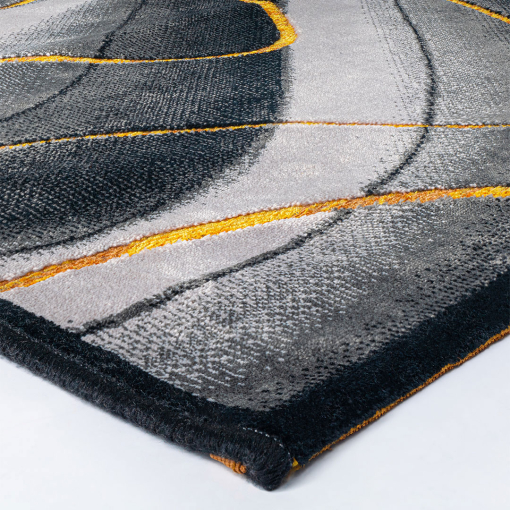 Close-up of 3D wave motif and yellow-orange accents on Gabrielle Waves Grey Yellow rug