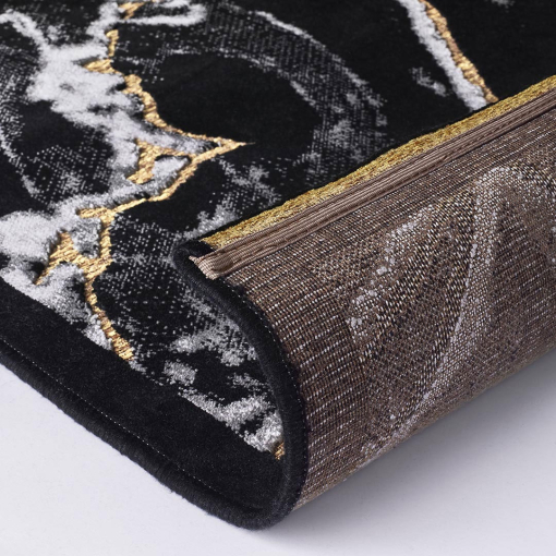 Close-up of marble-effect texture in black and light tones
