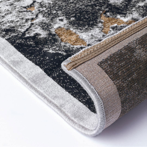 Close-up of golden textured details on Gabrielle rug