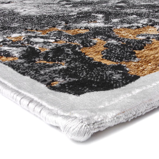 Close-up of golden textured details on Gabrielle rug