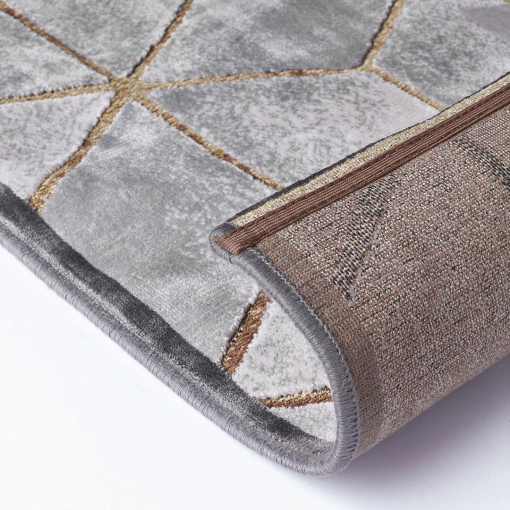 Close-up of 3D cube pattern in grey and gold