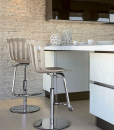 Tulip, entirely handcrafted in Italy, is an original adjustable bar stool, available in 3 different colours. Shop now for metal bar stool, made in Italy.
