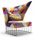 A curved shape luxurious armchair with patterned fabric and chrome steel base. A very suggestive high-quality piece of furniture. Free delivery.