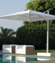 Big decentralized parasol in aluminium. 3x4 meters, sliding guides, 3 colours available (white, dove and grey). Online sale for the best outdoor furniture.