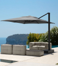 Big decentralized parasol in aluminium. 3x4 meters, sliding guides, 3 colours available (white, dove and grey). Online sale for the best outdoor furniture.