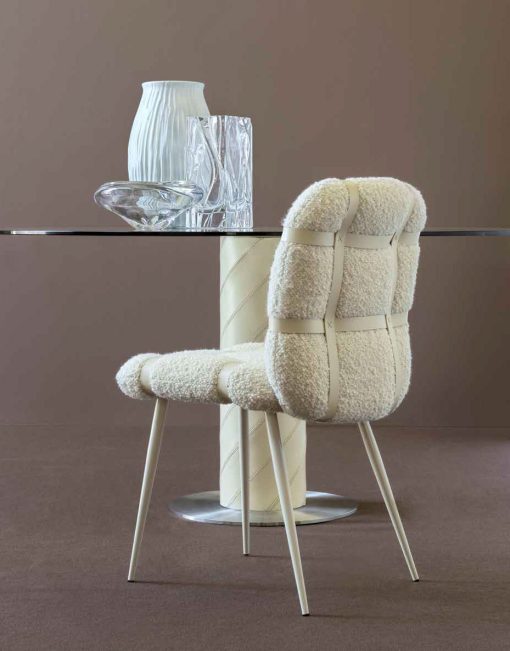 Archirivolto's padded dining chair with 4 legs, fabric upholstery and leather weaving. Made in Italy trendy character. Free home delivery.