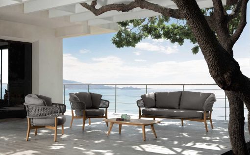 Luxurious outdoor lounge set in aluminium and teak signed by Cristian Visentin. Garden sofa, armchairs and coffee table. Shop online, free shipping.