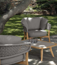 Luxurious outdoor lounge set in aluminium and teak signed by Cristian Visentin. Garden sofa, armchairs and coffee table. Shop online, free shipping.